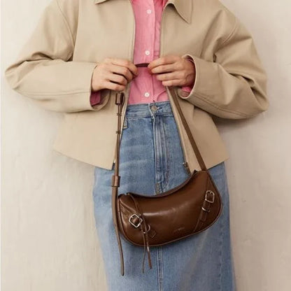 Elegant black shoulder and crossbody baguette bag made with premium split leather and synthetic lining