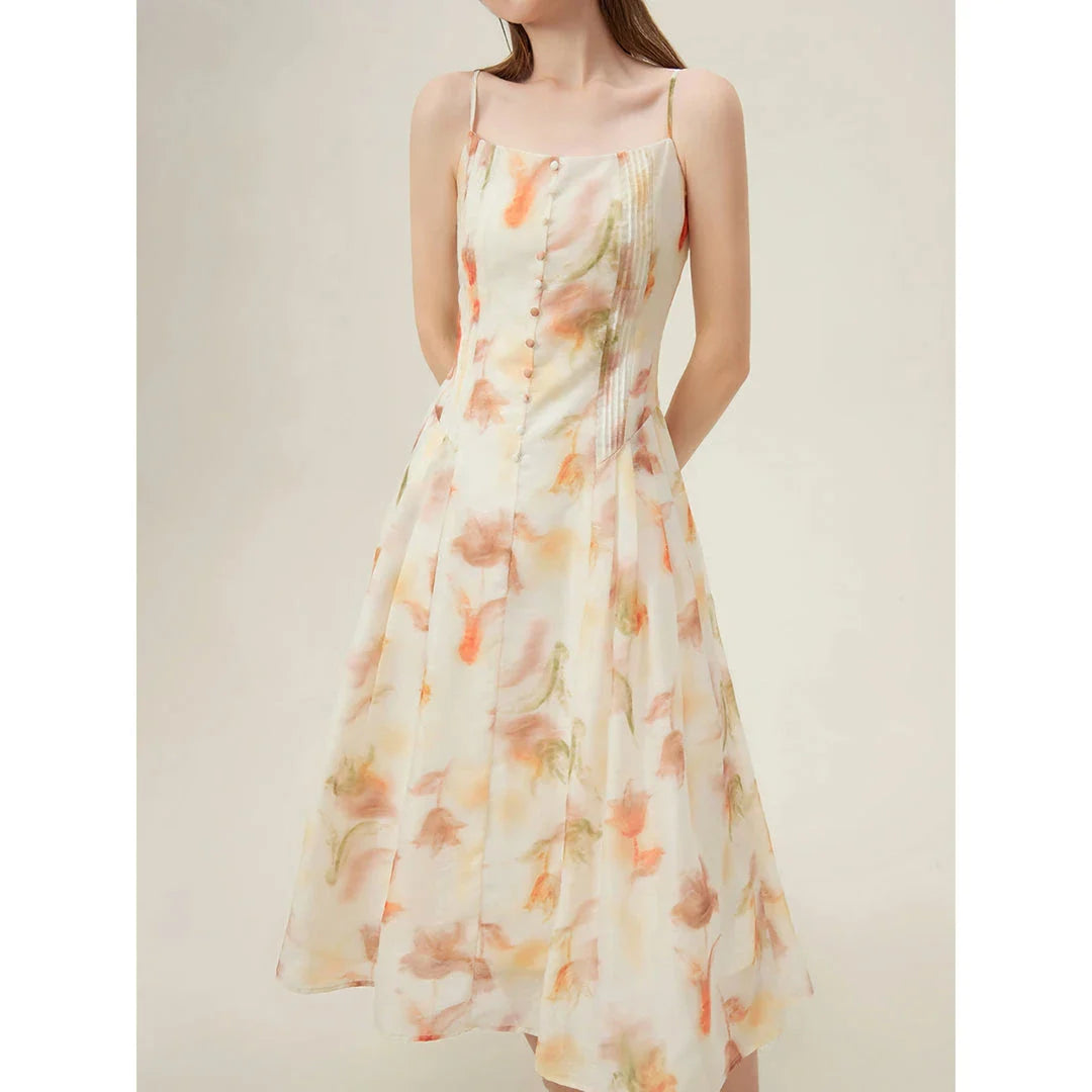Floral sleeveless summer dress with A-line silhouette and vibrant orange print, perfect for British summer occasions