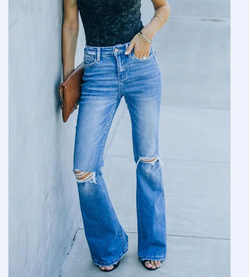 Premium distressed denim trousers for British women, featuring a high-waist silhouette and subtle ripped detailing
