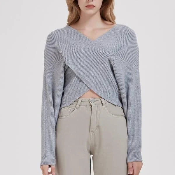A cosy, brown V-neck knitted jumper with a relaxed, comfortable fit and a touch of vintage-inspired style.