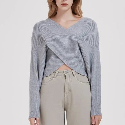 A cosy, brown V-neck knitted jumper with a relaxed, comfortable fit and a touch of vintage-inspired style.