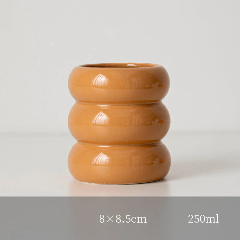 A white ceramic candlestick holder with a minimalist Nordic design, perfect for creating a cosy and sophisticated ambience in any room.