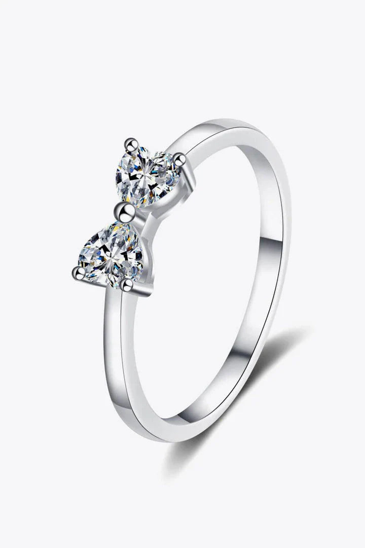 Elegant moissanite and sterling silver bow ring with a radiant, polished finish