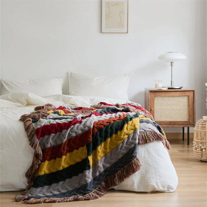 Elegant wool blanket with stylish plaid pattern and fringed tassels, perfect for cosy home decor and outdoor adventures.