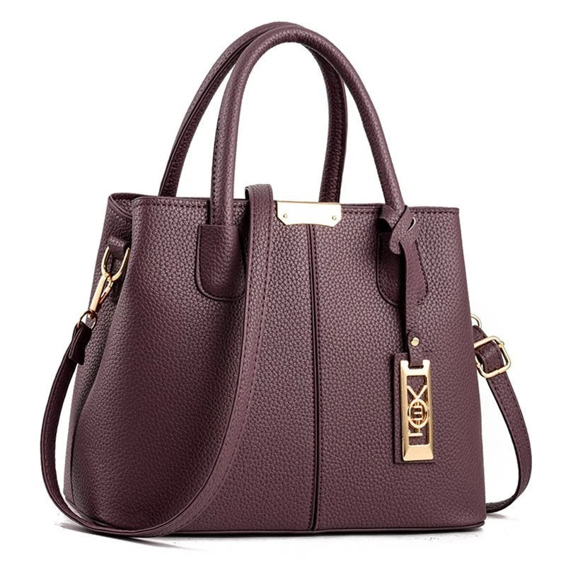 A stylish one-shoulder tote bag in various colours, made of premium polyester with an adjustable strap and spacious interior for the modern professional woman.