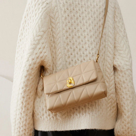 Premium genuine leather crossbody bag in a classic white colour, featuring an adjustable strap and a spacious interior with a zipper pocket.