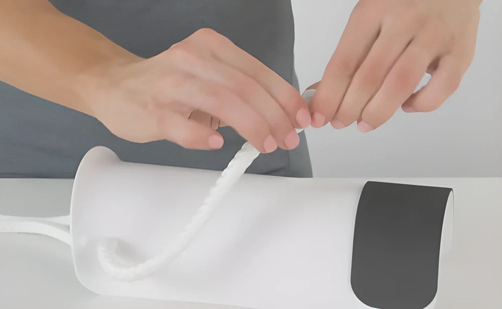 Ergonomic sock puller aid with soft, flexible shell and adjustable cord for easy sock-wearing