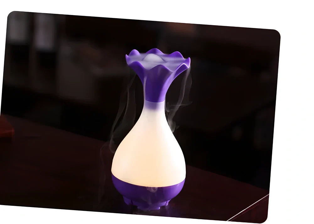 Ultrasonic aroma diffuser and humidifier with dimmed yellow light, creating a calming and relaxing atmosphere