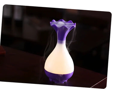 Ultrasonic aroma diffuser and humidifier with dimmed yellow light, creating a calming and relaxing atmosphere